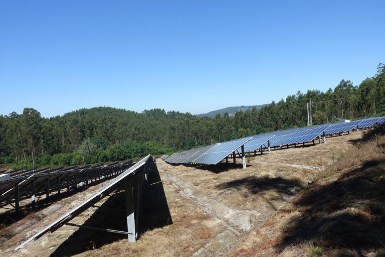 A solar farm at sunset generating record amounts of renewable electricity.
